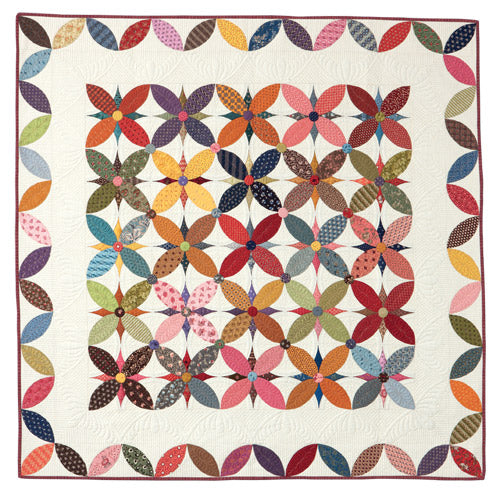 Flat shot of scrappy Alabama Beauty block quilt