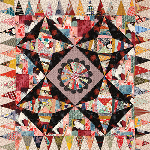 Flat shot of foundation pieced and appliqué string pieced asian quilt