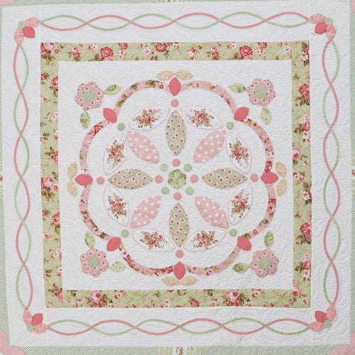 Closeup of centre appliqué design with appliqué flowers from traditional-style appliqué medallion quilt