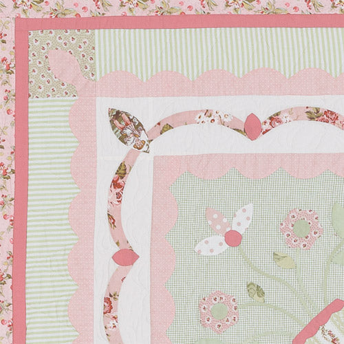 Closeup of corners of borders from traditional-style appliqué medallion quilt