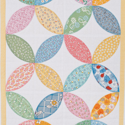 Closeup of orange peel blocks from appliqué orange peel quilt