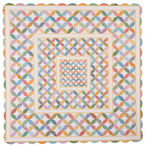 Flat shot of appliqué orange peel quilt