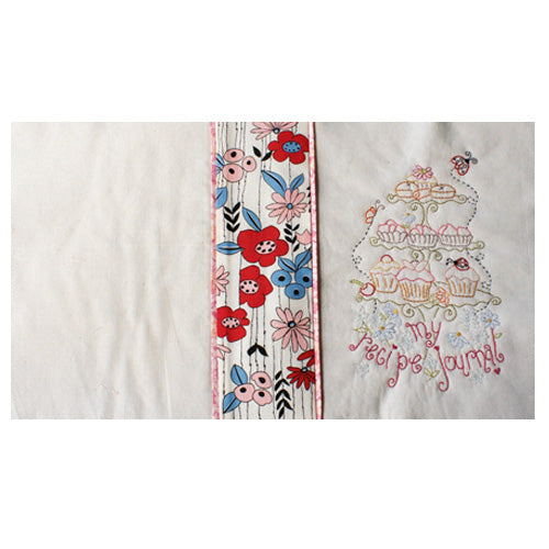 Flat shot of opened embroidered recipe journal