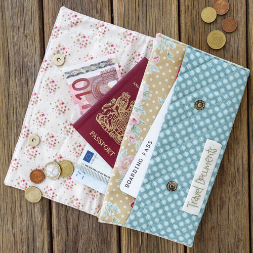 Styled shot of passport folio open with money and passport