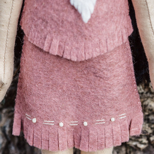 Detailed closeup of Pocahontas doll's embroidered skirt