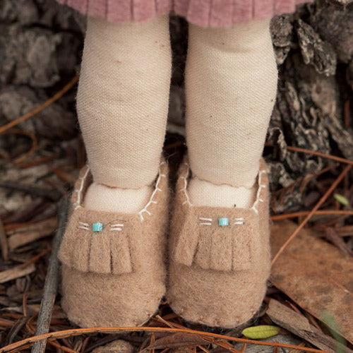 Detailed closeup of embroidered shoes on Pocahontas doll