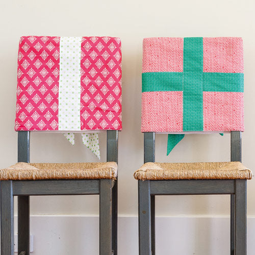 Backs of Christmas chair covers on chairs