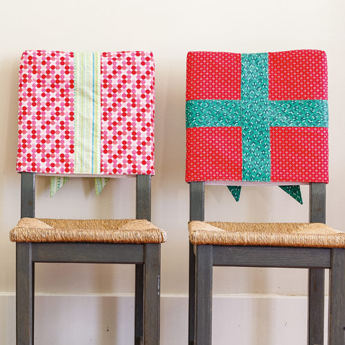 Backs of Christmas chair covers on chairs
