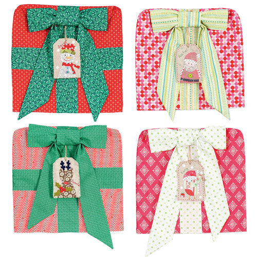 Flat shot of Christmas gift chair covers with appliqué and embroidered tags