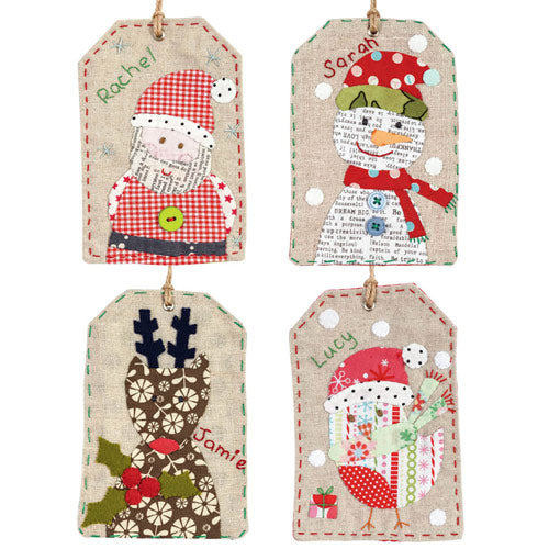 Flat shot of appliqué and embroidered Christmas gift tags