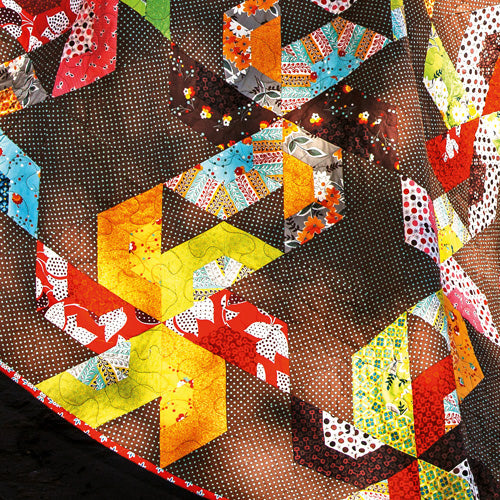Closeup of large pinwheel patchwork quilt
