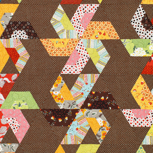 Closeup of blocks from large pinwheel patchwork quilt