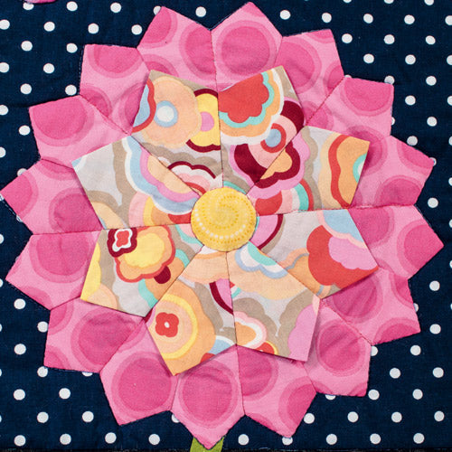 Closeup of pink pointed flower appliqué from night garden appliqué flower quilt