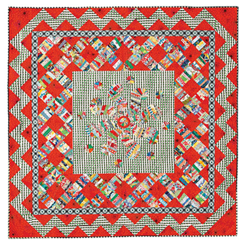 Flat shot of modern scrappy string pieced and appliqué quilt