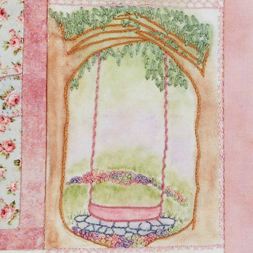 Detailed closeup of embroidered swing and flowers motif