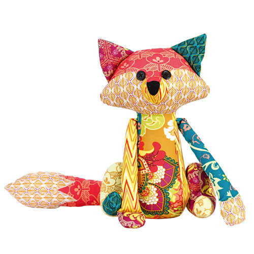 Flat shot of bright patchwork fox soft toy