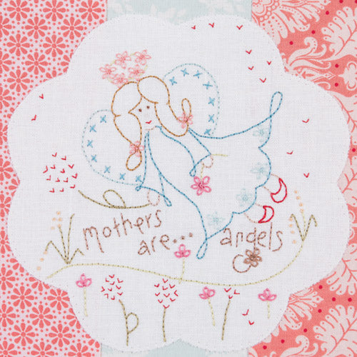 Closeup of embroidery design of angel, flowers and words 'mothers are…angels