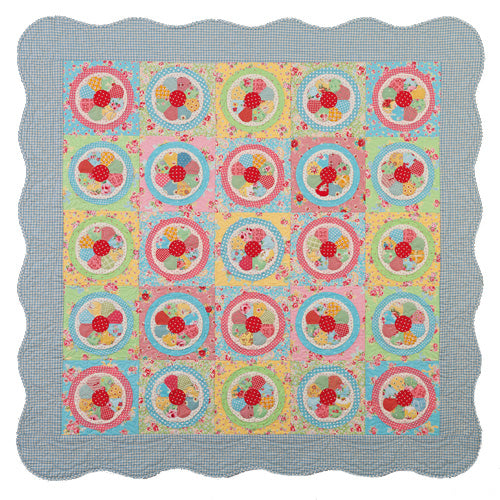 Flat shot of english paper pieced vintage dresden plate quilt
