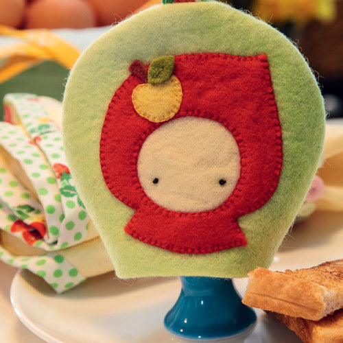 Closeup of autumn themed retro style egg cosy