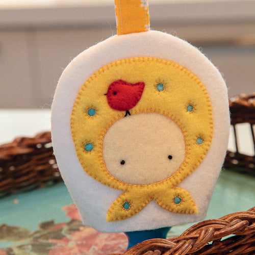 Closeup of spring themed retro style egg cosy