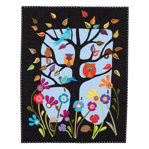 Flat shot of red and white patchwork star quilt appliqué owl, bird, flower and tree quilt