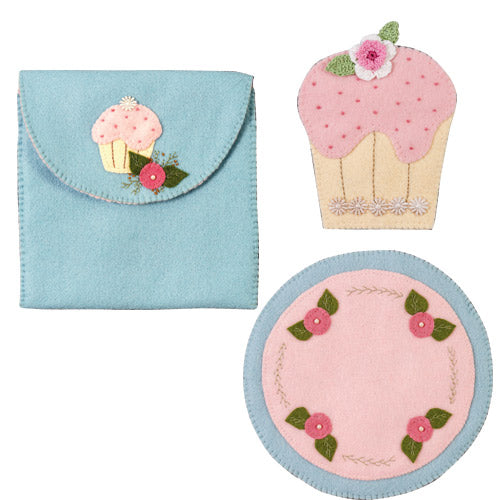 Flat shot of cupcake themed sewing accessories needlebook, mug rug and pouch