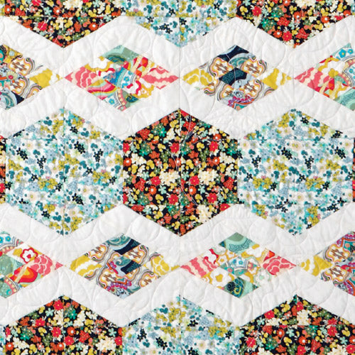 Closeup of hexagon and diamonds from diamond and hexagon patchwork quilt