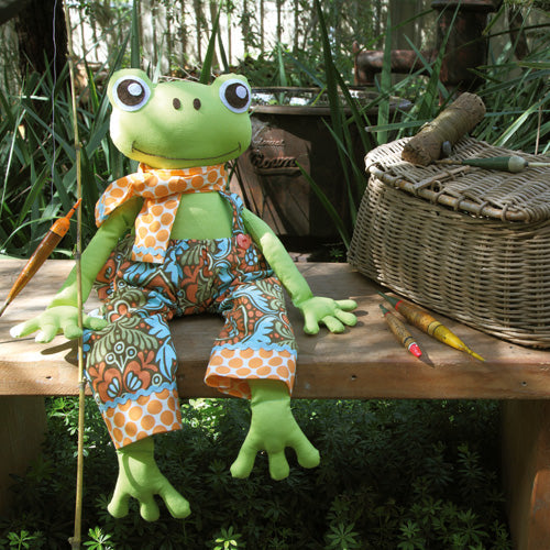 Styled shot of frog softie with fishing gear