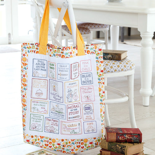 Styled shot of book bag with embroidered book cover designs