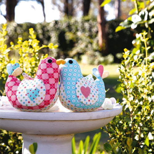 Styled shot of bird softies in bird bath outdoors