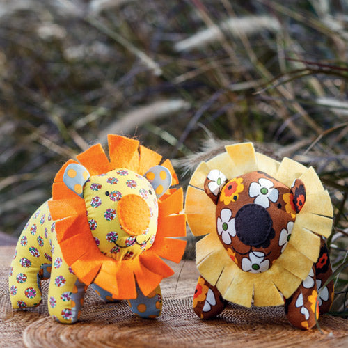Styled shot of retro-style lion softies in garden