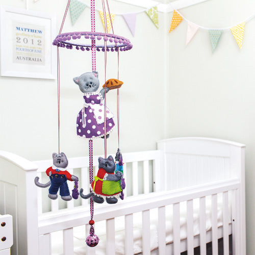Styled shot of three little kittens nursery rhyme mobile hanging up in nursery